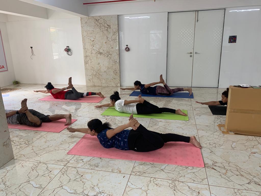 Yoga instructor guiding students in Pune